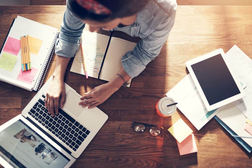 Businesswoman working and typing laptop in office